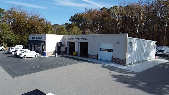 Wide view of the finished Mitchell Mill Motors service and repair center showing the addition tied into the existing building